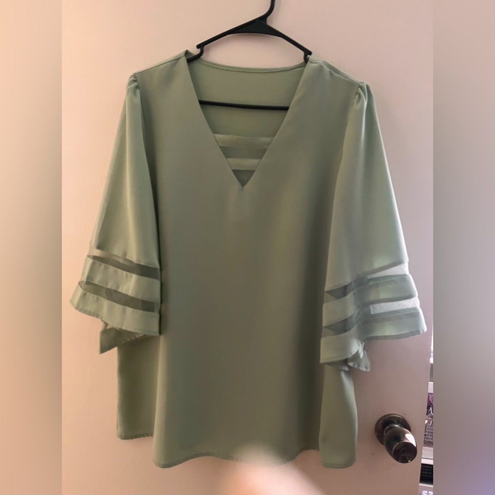 Beautiful top with bell sheer stripe sleeves.